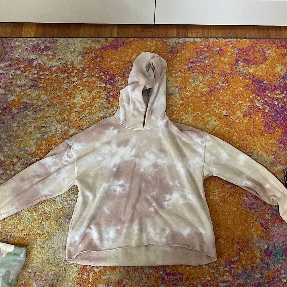 A sweater that is tye dyed with brown white and gray also gently used no tags